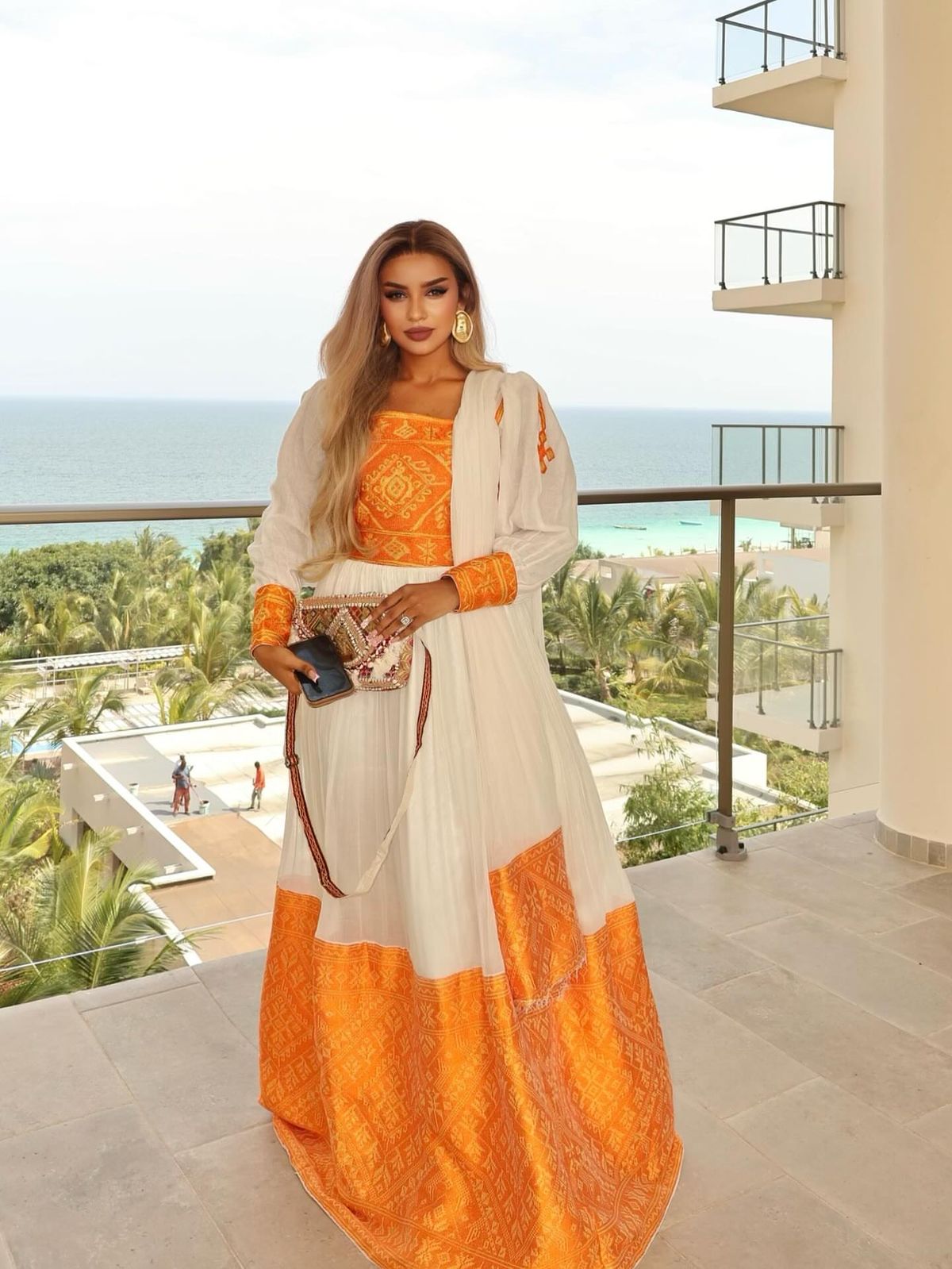 traditional dresses_Elegant Habesha Kemis Vibrant Orange Ethiopian Dress