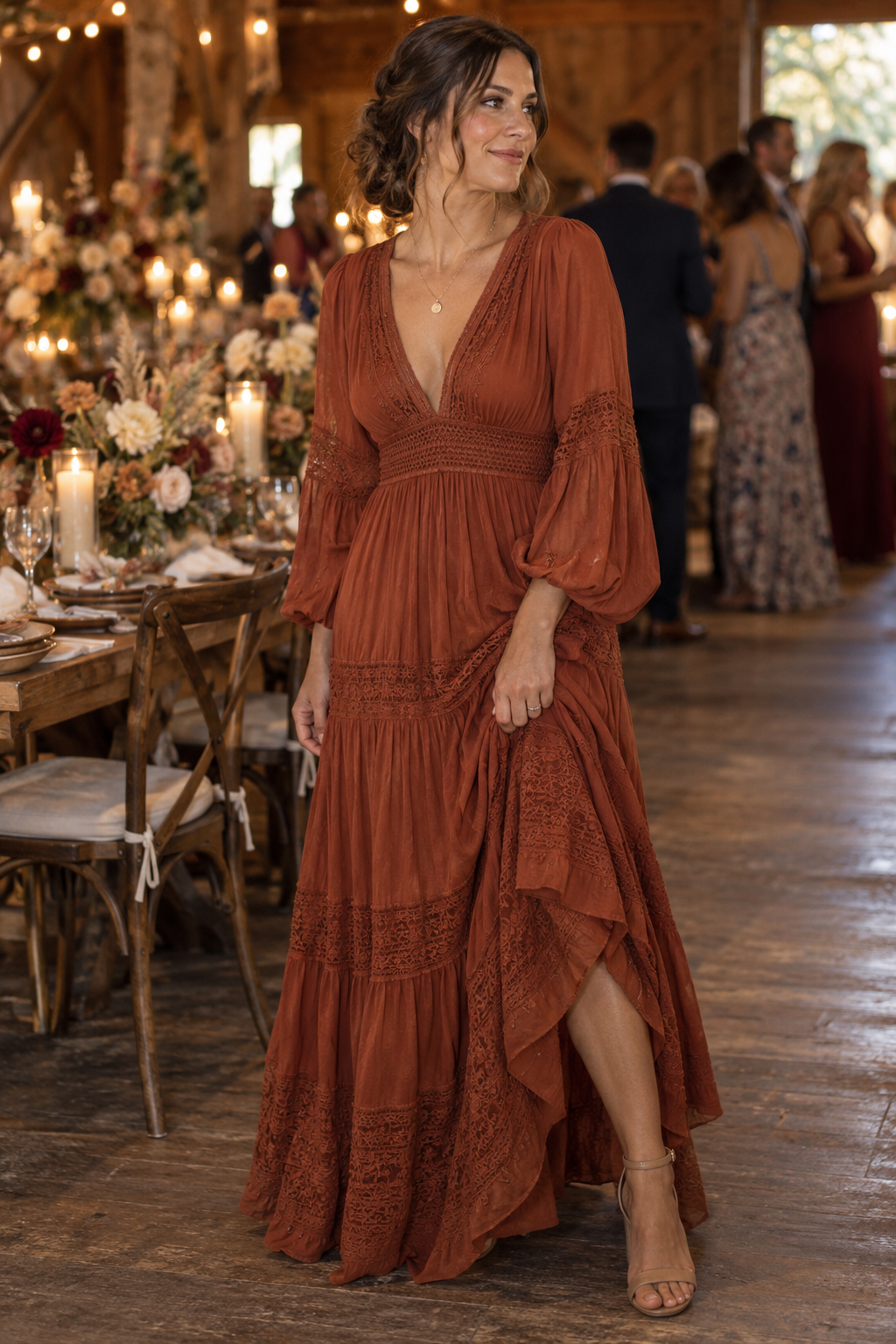 Adult guest in a rust bohemian maxi dress at an indoor wedding reception